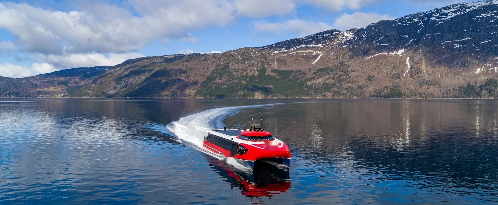 OBLUE AERO 36 carbon fiber fast ferry running at speed in a Norwegian fjord
