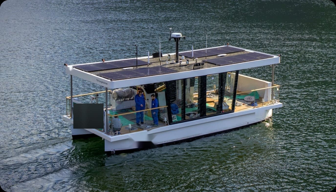 OBLUE FERRY 12E autonomous electric ferry from above, solar roof and open deck