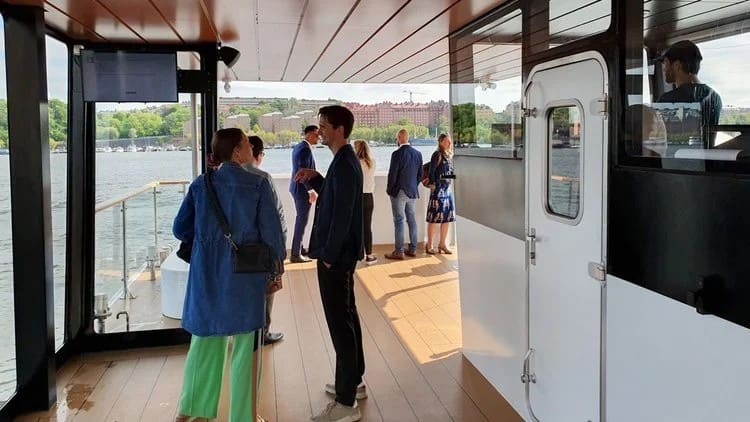 Passengers on the open panoramic deck of the OBLUE FERRY 12E
