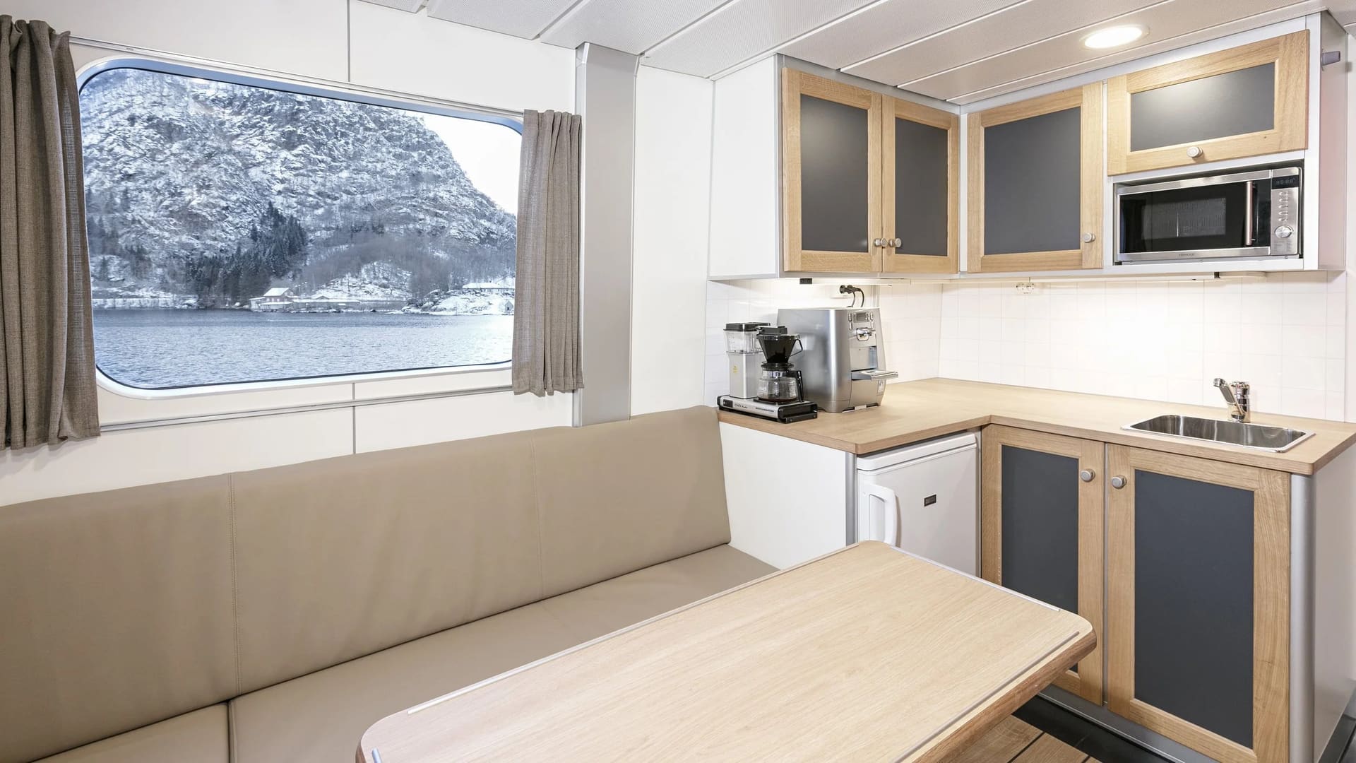 Crew mess with galley and seating aboard the OBLUE FERRY 26