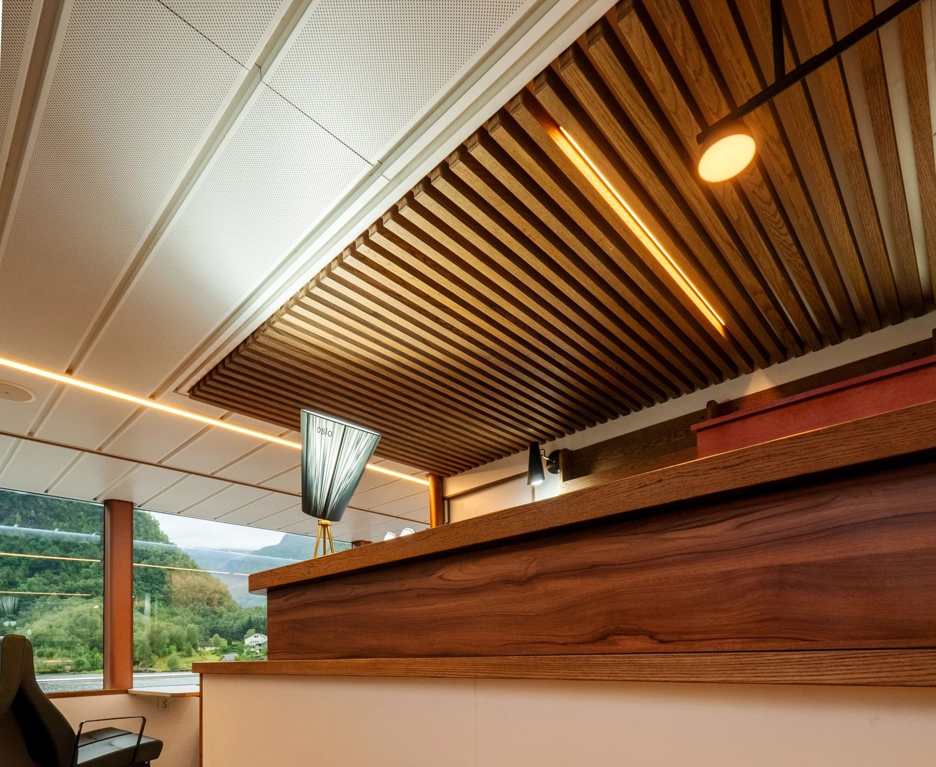 Timber-clad kiosk and pantry counter inside the OBLUE FERRY 26H