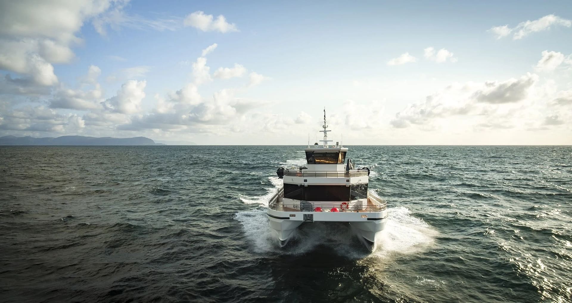 OBLUE FERRY 26H stern view underway, twin hulls and superstructure