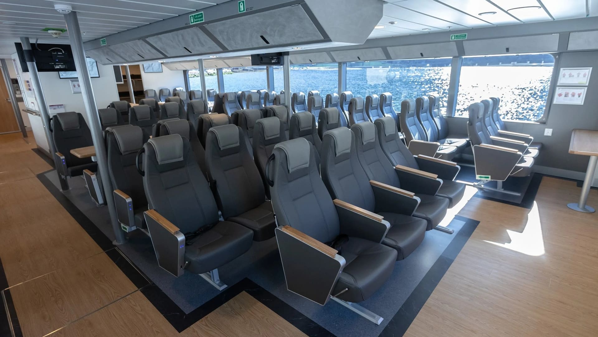 Main-deck saloon of the FERRY 30 with rows of seats and sea views