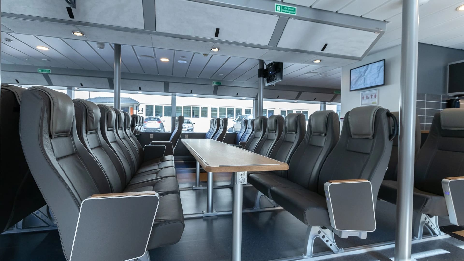 Seat groups with tables inside the saloon of the FERRY 30