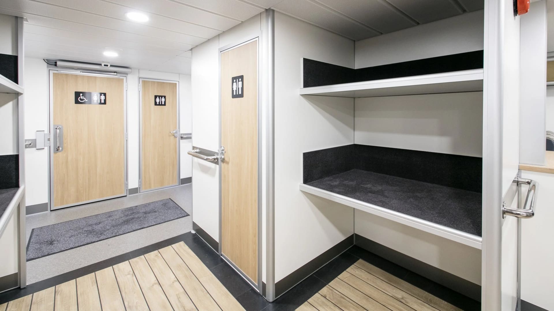 Luggage racks and W.C. doors aft on the FERRY 32