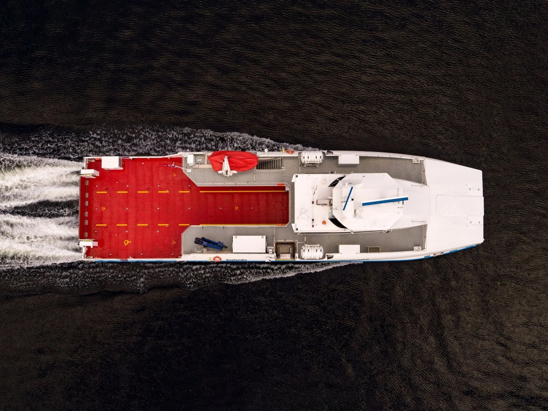 Top-down aerial view of the FERRY 37 showing the full-length car deck