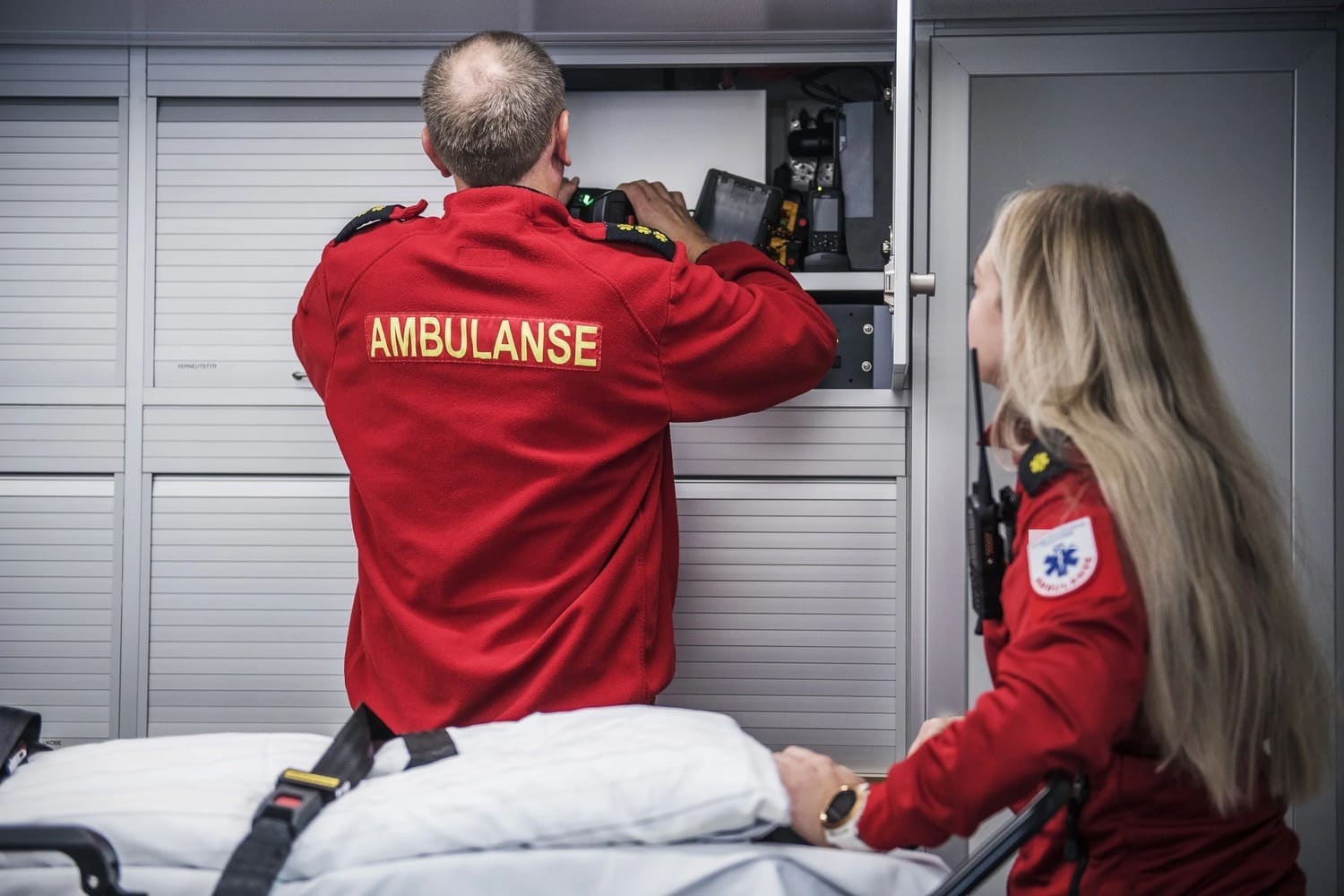 Ambulance boat crew at the medical equipment lockers