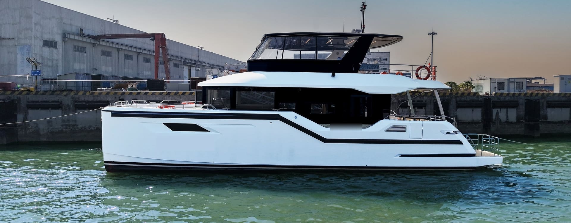 OBLUE SEASIGHT 18 carbon fiber sightseeing catamaran, starboard profile at the builder's quay