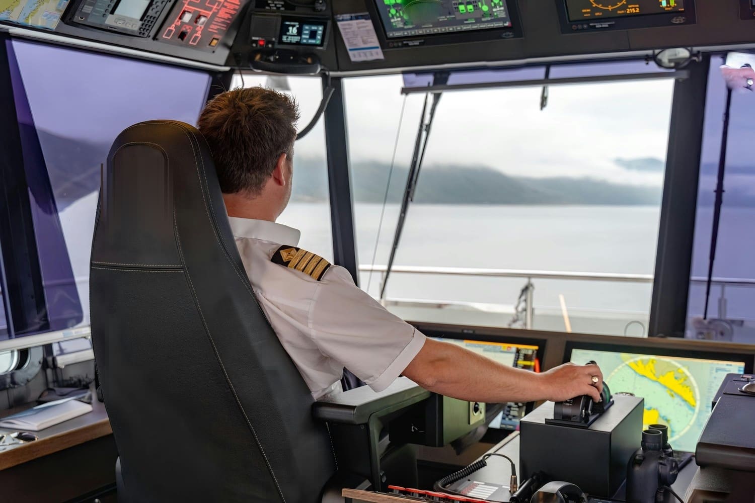 Captain at the helm of the SEASIGHT 26